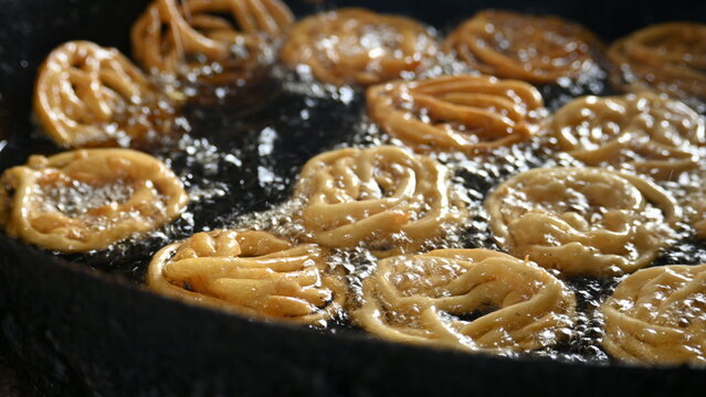 Jalebi making. It is a popular sweet snack in India subcontinent. It is many names&nbsp;jilapi,&nbsp;jilebi,&nbsp;jilipi,&nbsp;zulbia,&nbsp;mushabak,&nbsp;z&rsquo;labia and&nbsp;zalabia. Its made by maida flour&nbsp;batter&nbsp;and sugar syrup.