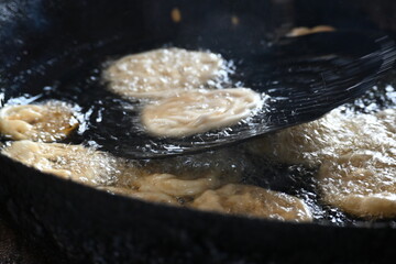 Jalebi making. It is a popular sweet snack in India subcontinent. It is many names jilapi, jilebi, jilipi, zulbia, mushabak, z’labia and zalabia. Its made by maida flour batter and sugar syrup.