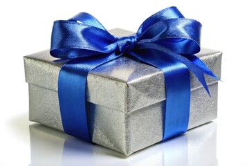 Fototapeta premium A shimmering silver gift box, adorned with a royal blue ribbon bow, gleams against a stark white backdrop in a long exposure photograph.