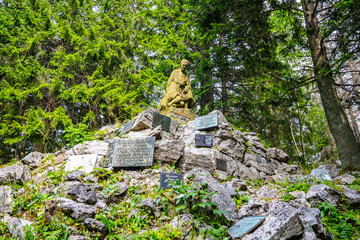 In the serene Demanovska Valley, a symbolic cemetery stands as a tribute to the victims of the Low...