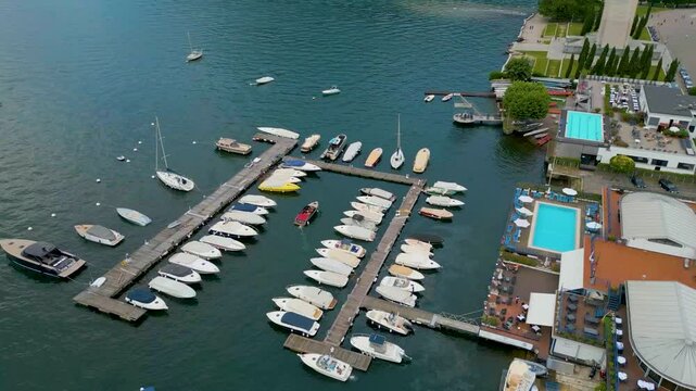 4K Aerial Drone Video of Boat Entering the Marina on Beautiful Lake Como, Italy in the Summer