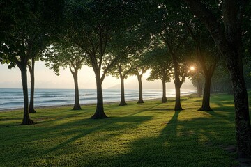 Obraz premium Silhouettes of trees at the beach during a stunning sunrise, where sunlight peeks through, creating a magical atmosphere that blends nature and tranquility.