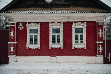 Naklejka premium old Russian houses with carved window frames