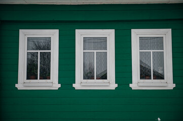 Fototapeta premium old Russian houses with carved window frames