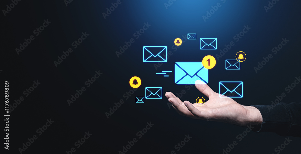 Poster digital email notifications floating above a hand on a dark background.