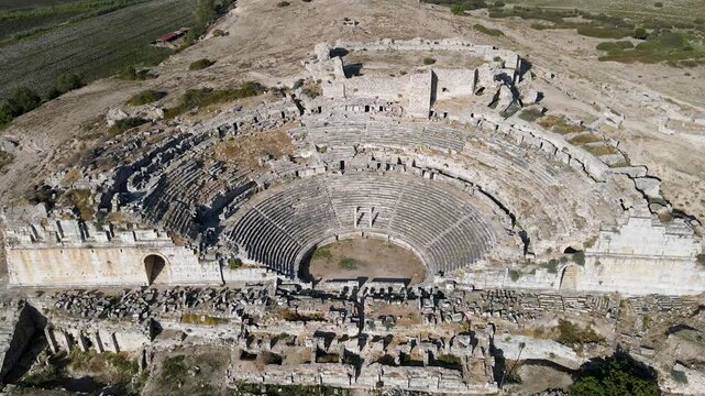 Footage of historical ruins, columns, ancient theater and temples in the ancient city of Miletus.