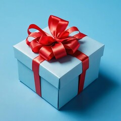 Obraz premium A gift box with a red bow on a blue background