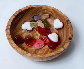 Colorful candies in a wooden bowl. Sweets