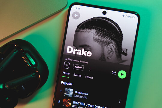 A smartphone displaying Drake's artist profile on Spotify.