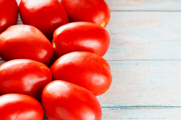 Vibrant Red Tomatoes from Local Harvest on Wooden Table for Sustainable Vegetarian Cooking, Copy Space