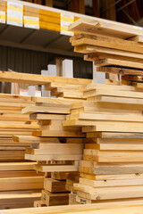 Fototapeta premium Stacks of wooden planks and boards