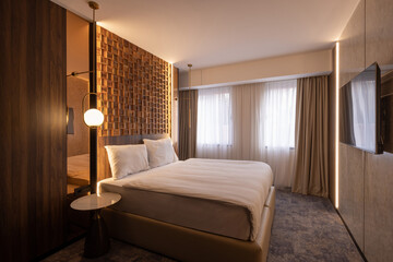 Modern hotel bedroom interior with master bed