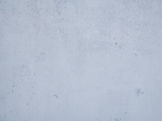 Bright wall with tiny pieces of dirt and wear