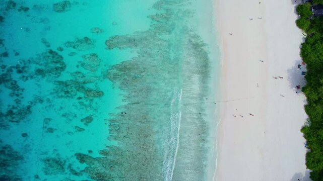 Nature of the beach and sea Summer with sunshine, sandy beaches, clear blue waters sparkling against the blue sky. On an island with good ecology and environment Background for summer vacation