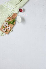 Minimalist Culinary Scene Fresh Mushrooms and Herbs on Rustic Cutting Board