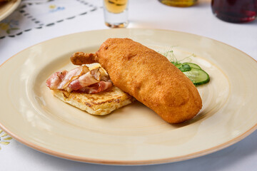 Gourmet Chicken Kiev Cutlet with Toast and Bacon A Culinary Photograph with Warm Tones and Artistic Composition