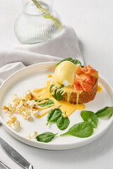 Elegant Brioche with Salmon, Poached Egg, and Hollandaise Sauce on Minimalistic Plate