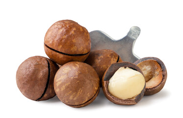Heap of macadamia nuts with key close-up on white. Isolated