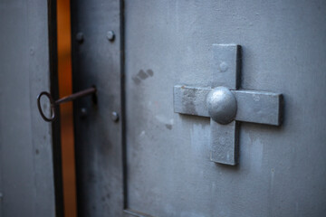 Focused Cross Imprint on Ancient Church Door