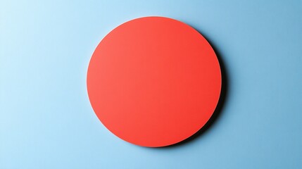 Bold red circle against a light blue background creates striking visual contrast