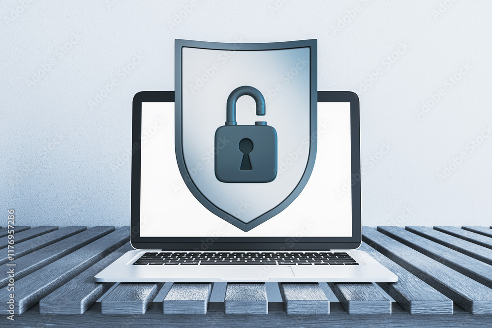 Poster laptop with shield and unlocked padlock symbol on display, placed on wooden table against light back