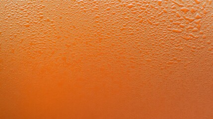 Naklejka premium Stunning Orange Liquid Surface with Water Droplets. Detailed Texture of Water Beads on a Surface. A Closeup View of the Water Patterns.