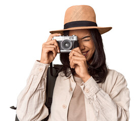 Traveling Filipino young woman with vintage camera