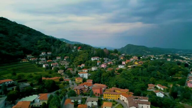 4K Aerial Drone Video of Mountainside Farmhouses and Vineyards in Cavallasca, Italy on a Summer Evening