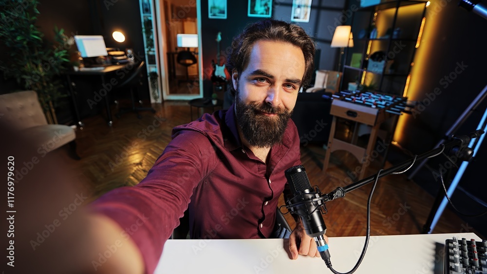 Aufkleber upbeat content creator hosting online show in rgb lights studio, shooting vlog using selfie camera. 
