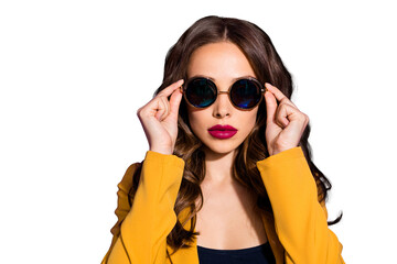 Fototapeta premium Photo of cool astonishing girl watching into camera through sunglass while being isolated with purple background