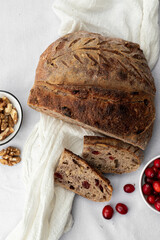 Artisan Cranberry and Walnut Sourdough Bread on a Rustic Setting