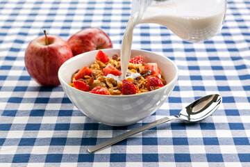 Healthy breakfast with corn flakes, milk and fresh fruit