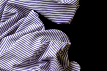 Blue and white striped fabric background. Blue and white striped fabric texture on black background