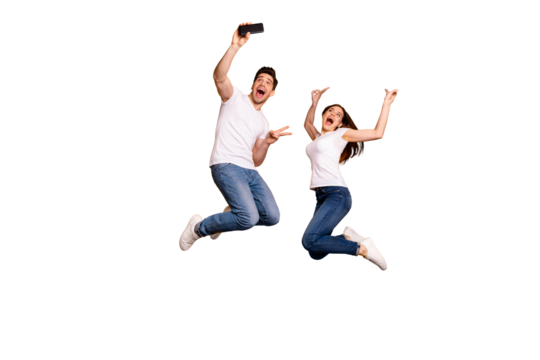 Full length side profile body size photo funky funny two people she her he him his guy lady jump high show v-sign make take selfies wear casual jeans denim white t-shirts isolated yellow background