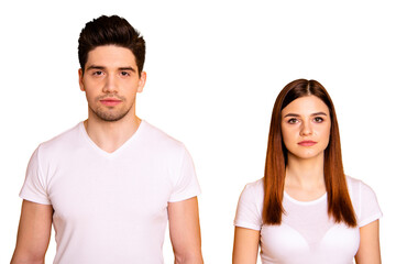 Close up photo two cool amazing beautiful she her he him his couple standing side by side not smiling look through like zombie wearing casual white t-shirts outfit clothes isolated yellow background