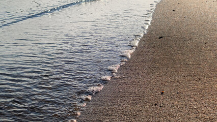 pattern of blue sea water with small waves
