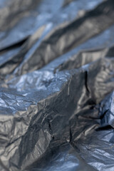 a piece of black soft paper for packaging goods and objects