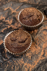 fresh and soft black chocolate cupcake on black paper