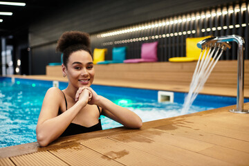 Enjoying a relaxing moment by the tranquil spa pool with a beautiful young woman
