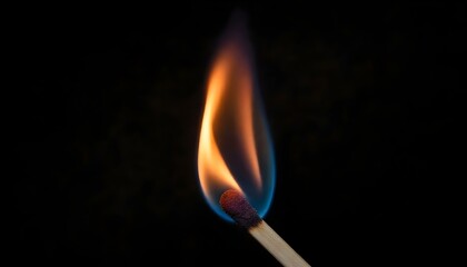 Burning match with vibrant, colorful flames against a dark background