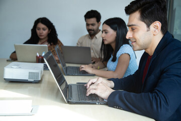 Fototapeta premium Group Of Employees Are Working On Laptop