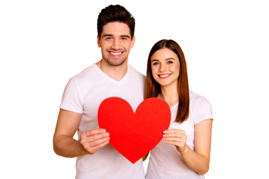 Close up photo two beautiful people she her he him his guy lady fiance bride hold hands arms heart shape form paper postcard excited best emotions wear casual white t-shirts isolated yellow background