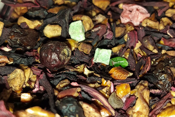 Dry tea with dried fruits close-up. Dried rosehip berries for tea. Dry fruits for hot drinks. 