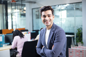 Startup Consultant In Formal Wear Smiling While Posing In Front Of Camera