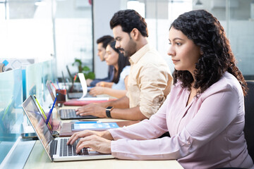 Hardworking Employees Working On Laptop