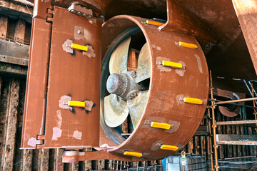 Close up of a ship's rudder and variable pitch propeller in dry dock