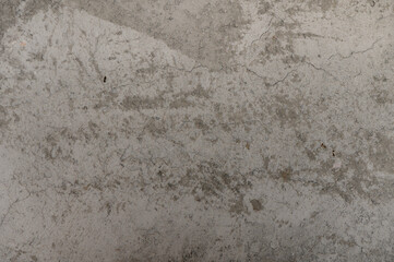 Textured surfaces blend with subtle hues in an urban backdrop during daylight