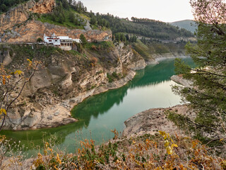 Fototapeta premium Iznájar Reservoir. The largest reservoir in Andalusia. Green water. Effects of drought.