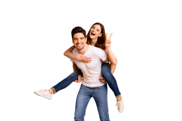 Portrait of his he her she two nice lovely charming attractive cheerful cheery positive people showing v-sign isolated over vivid shine bright yellow background