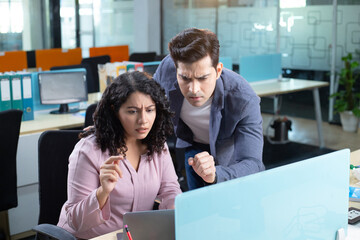 Corporate People Reading Bad News On Line In A Laptop At Office